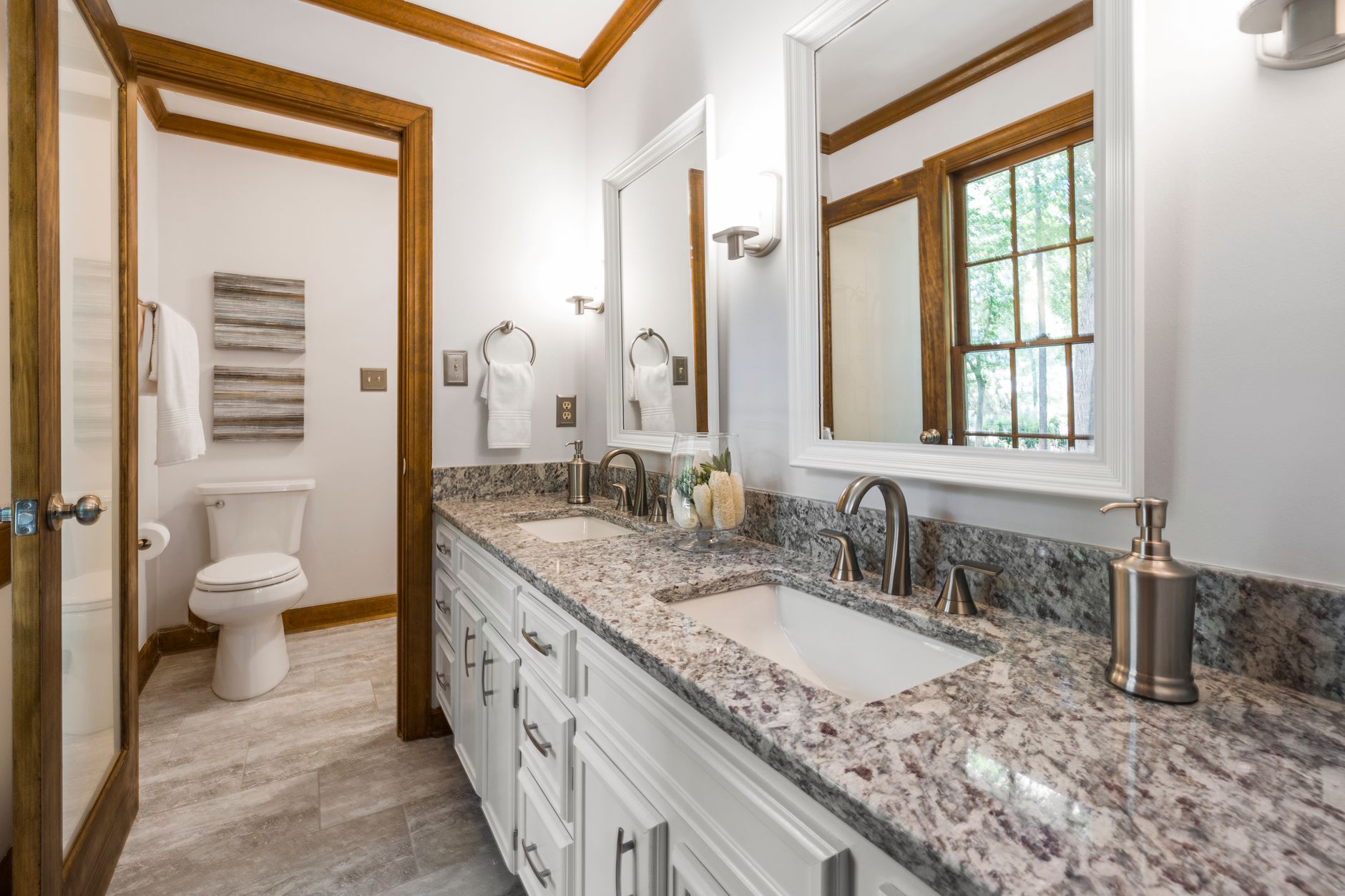 Bathroom vanity with a granite countertop and double sinks